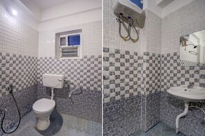 Habitación estándar doble | Baño | Ducha y toallas