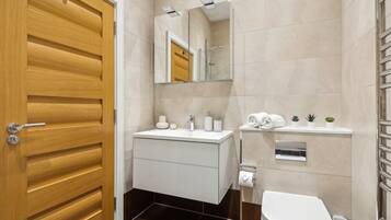 Combined shower/tub, hair dryer, towels, soap