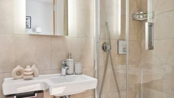 Combined shower/tub, hair dryer, towels, soap