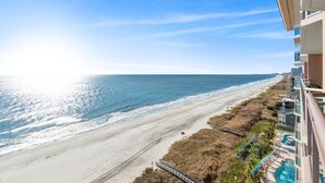 A beachfront hotel with a view of the ocean and beach. - Bahama Sands 1106, 3 BR Ocean Front Luxury Condo with Indoor Outdoor Swimming Pool, Hot Tub, Lazy River and Kiddie Pool (North Myrtle Beach)