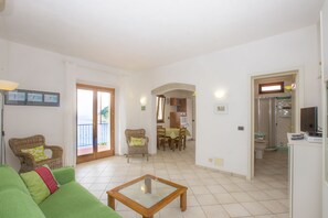 Apartment, 2 Bedrooms (La Gabbiana) | Living area | Flat-screen TV - Appartamento La Gabbiana (Portoferraio)