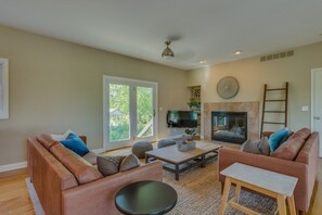 TV, fireplace - Journeyman Distillery Farmhouse in Three Oaks! Three Night Summer Minimum! (Three Oaks)