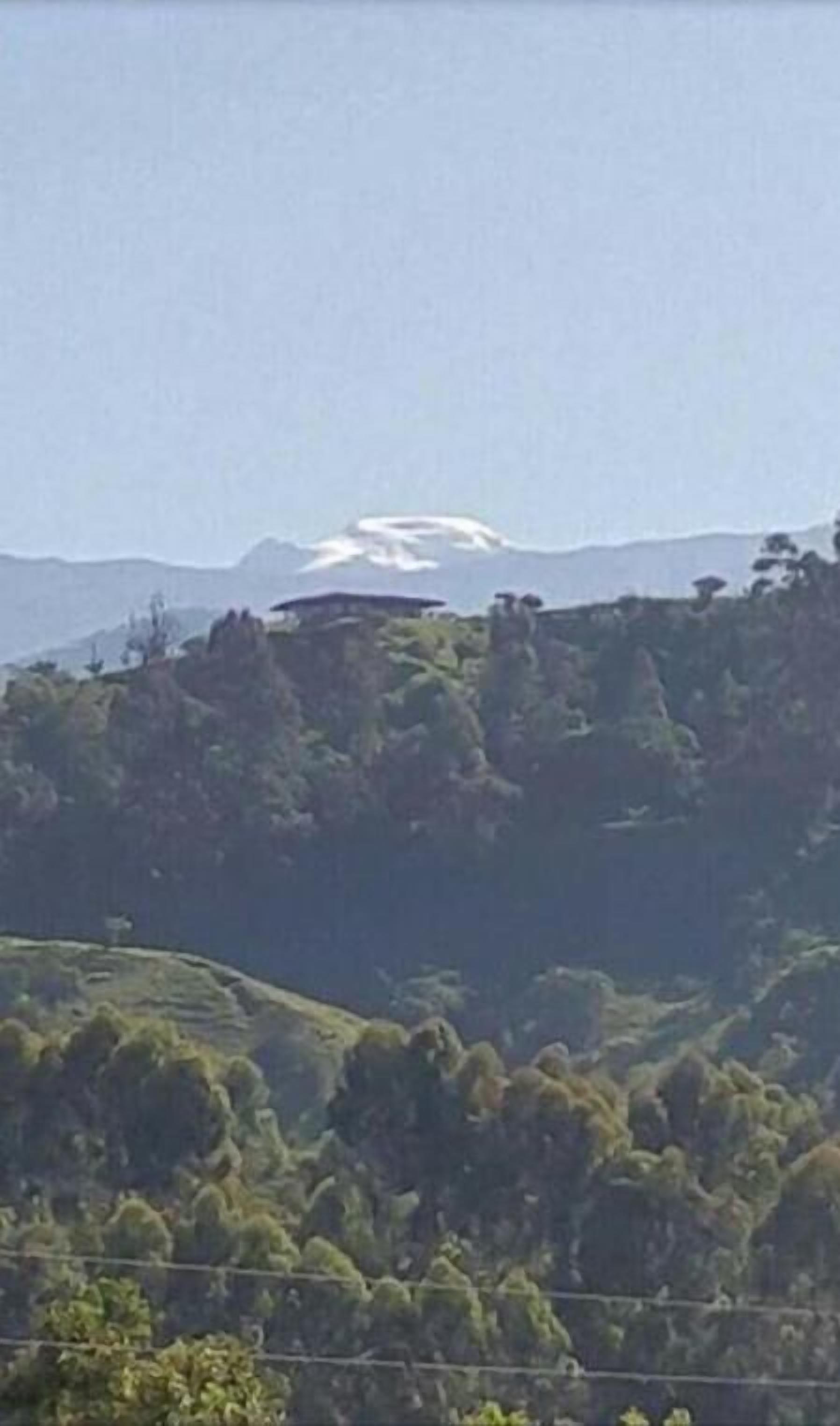 A mountainous landscape with a clear sky.