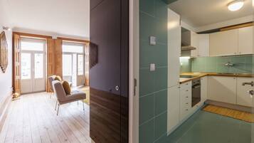 Design Apartment, 2 Bedrooms, City View | Living area | 32-inch LCD TV with cable channels, TV