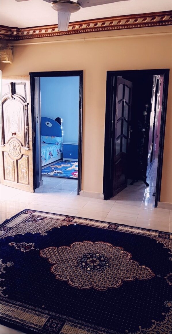 Stylish room with a large rug, a bed, and a window.