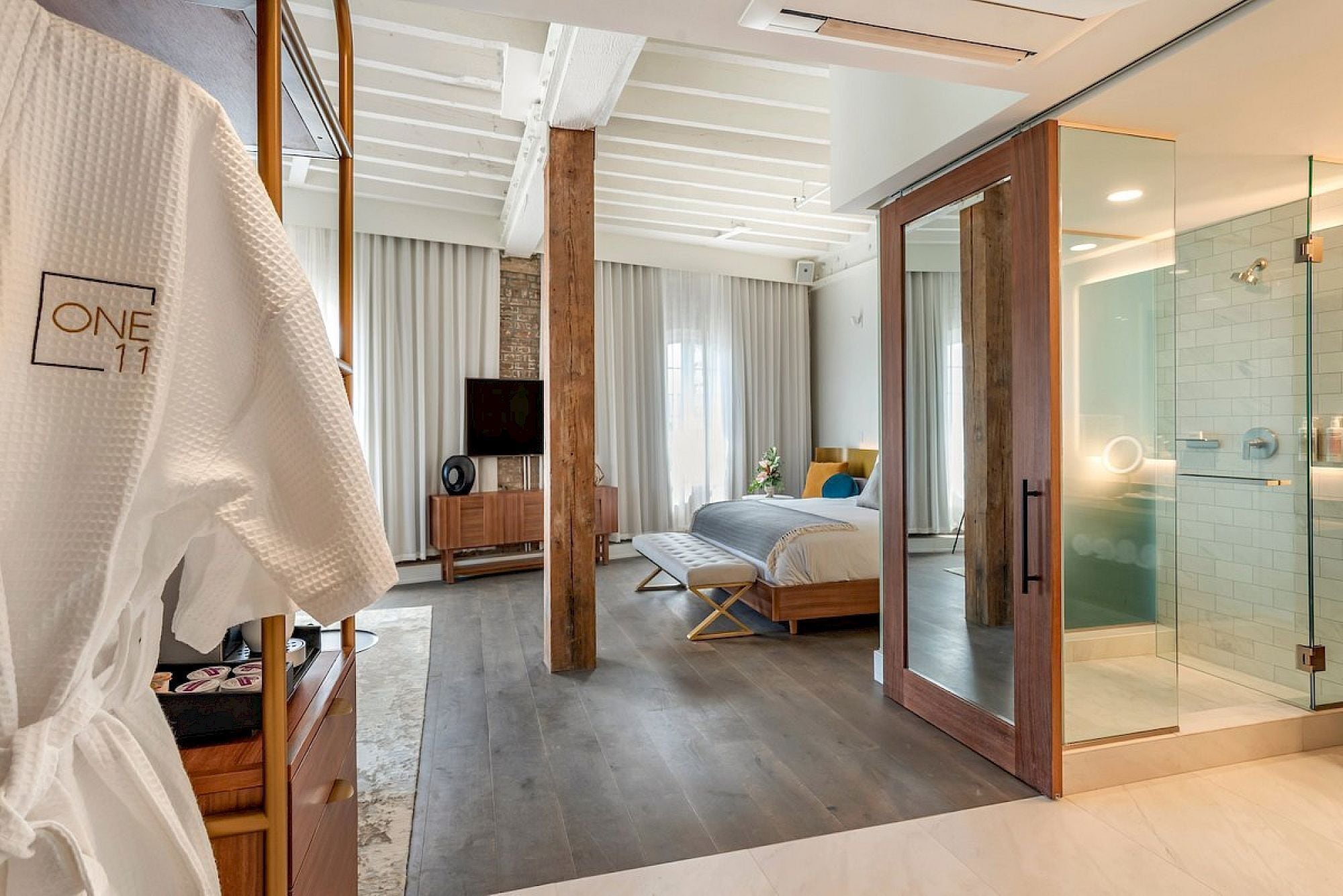 signature studio suite, 1 king bed, river view | bathroom | shower, designer toiletries, hair dryer, towels