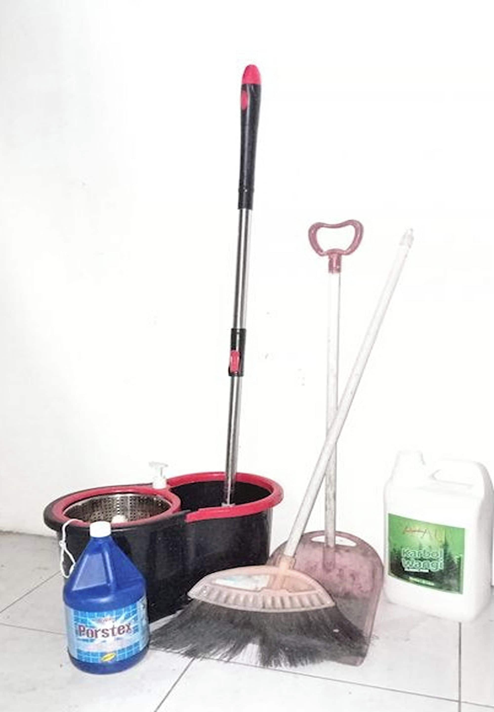 A mop, a broom, a dustpan, and a cleaning liquid bottle.