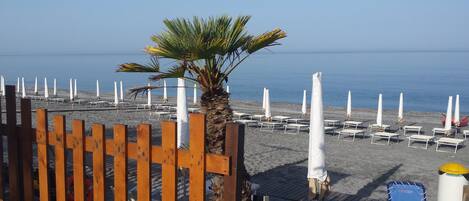 Private beach nearby, black sand, beach shuttle, beach umbrellas