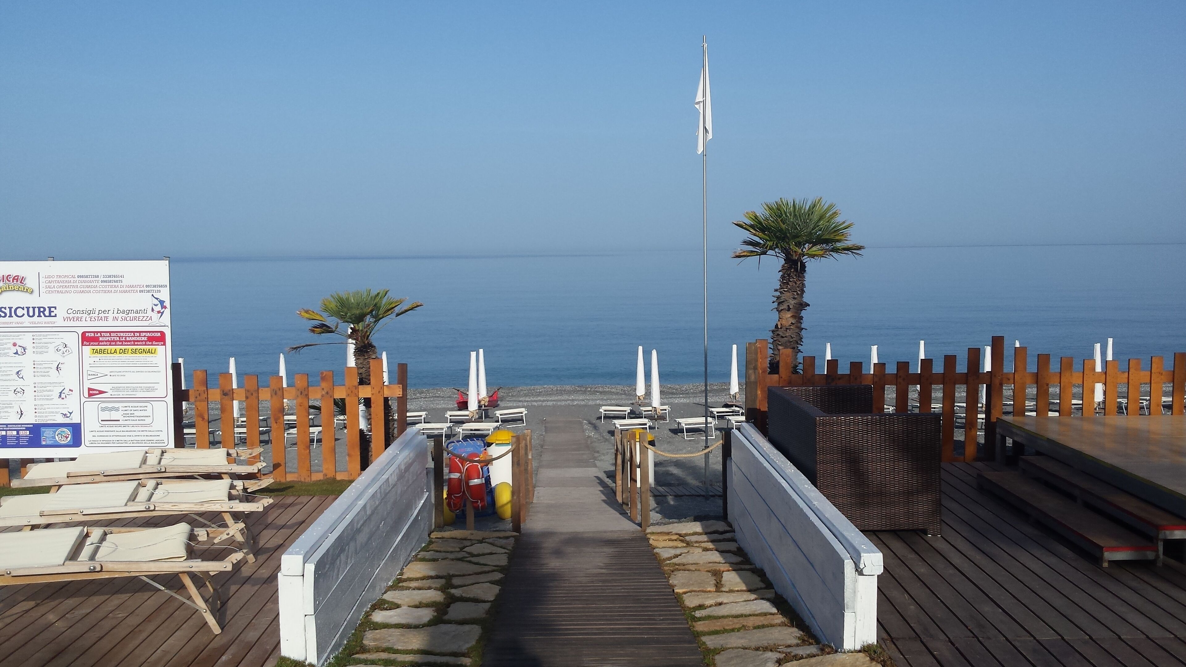 Private beach nearby, black sand, beach shuttle, beach umbrellas