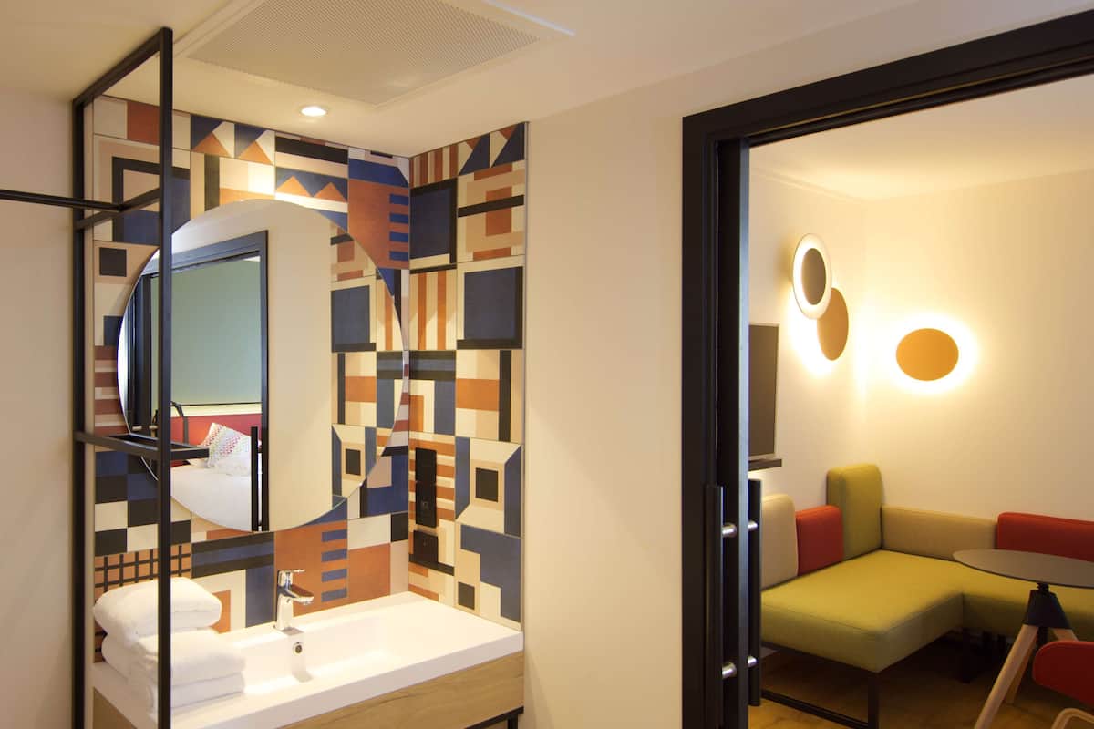 executive room, 1 king bed | bathroom | rainfall showerhead, eco-friendly toiletries, hair dryer, towels