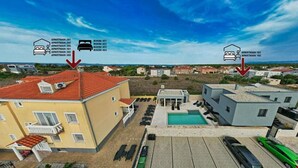 A residential area with multiple apartment buildings, each marked with arrows indicating their location. - Room in Zaton (Zadar) with Seaview, Terrace, WIFI, Washing machine (4141-7) (Nin)