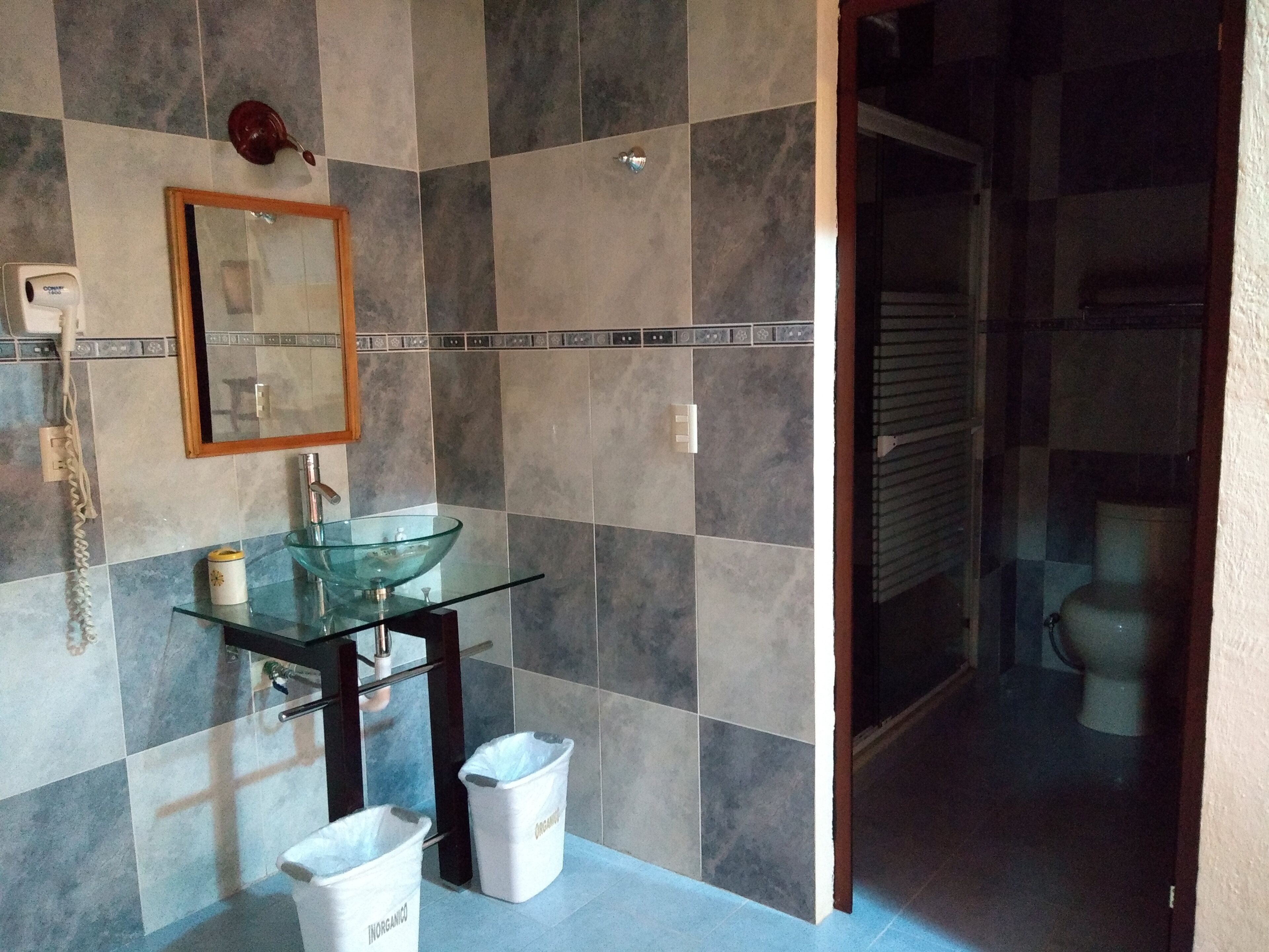 family room | bathroom | shower, rainfall showerhead, hair dryer, towels