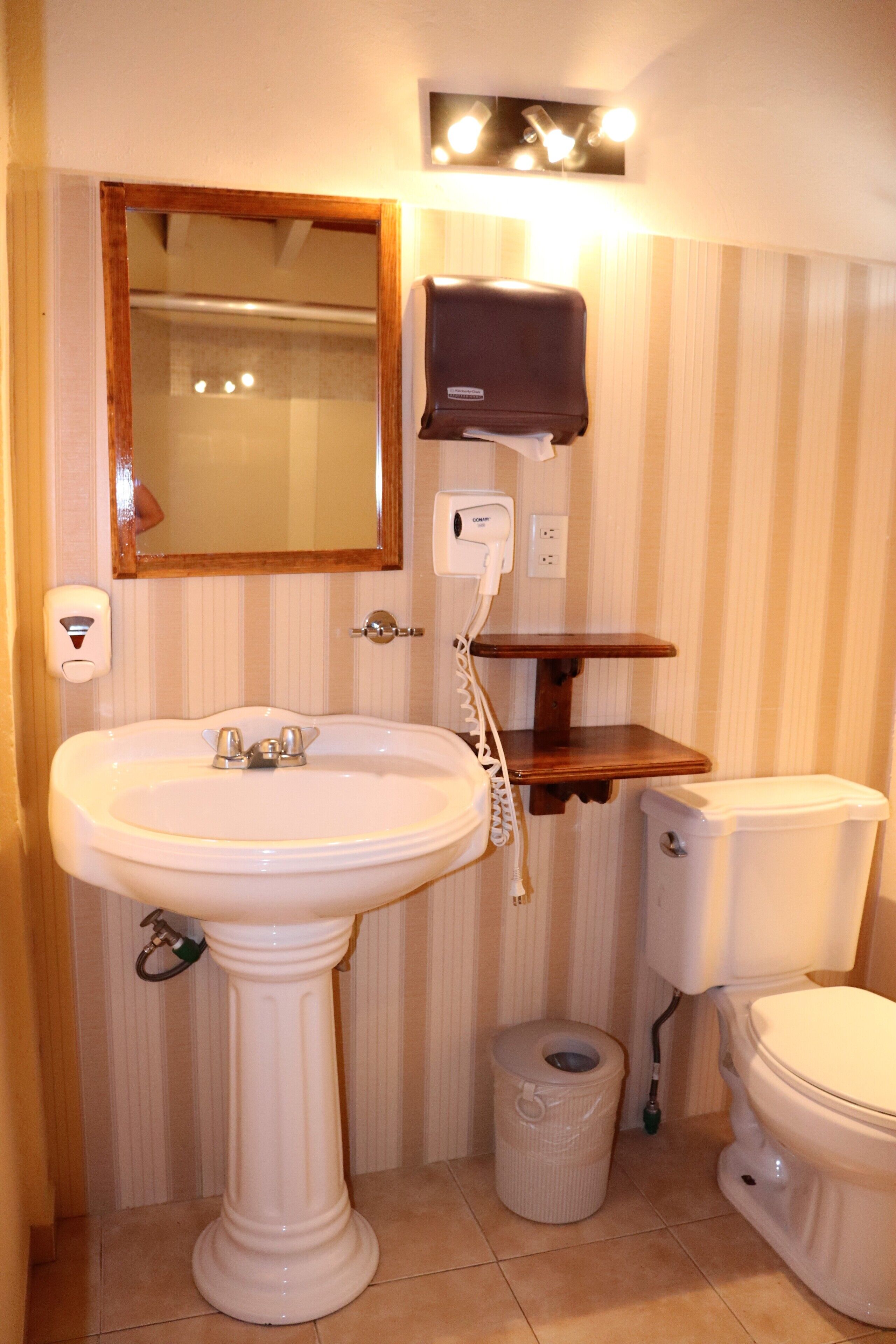 superior room | bathroom | shower, rainfall showerhead, hair dryer, towels