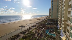 A beachfront hotel with a pool area, a beach, and a clear view of the ocean. - Ocean Beach Club - 1BR/1BA - Amazing Oceanfront Views! (Virginia Beach)