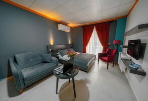 Deluxe Room | Premium bedding, in-room safe, blackout drapes, iron/ironing board