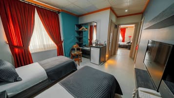 Suite Confort | Caja fuerte, cortinas opacas, tabla de planchar con plancha