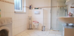 Bathtub, hair dryer, towels, soap