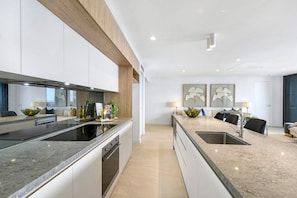 Executive Suite Ocean View | Private kitchen | Full-size fridge, microwave, oven, stovetop - Vue Broadbeach (Broadbeach)