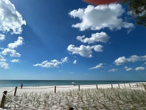 A beach with a clear sky and a rope barrier. - Healthy, relaxing , romantic , organic vacation - (Naples)