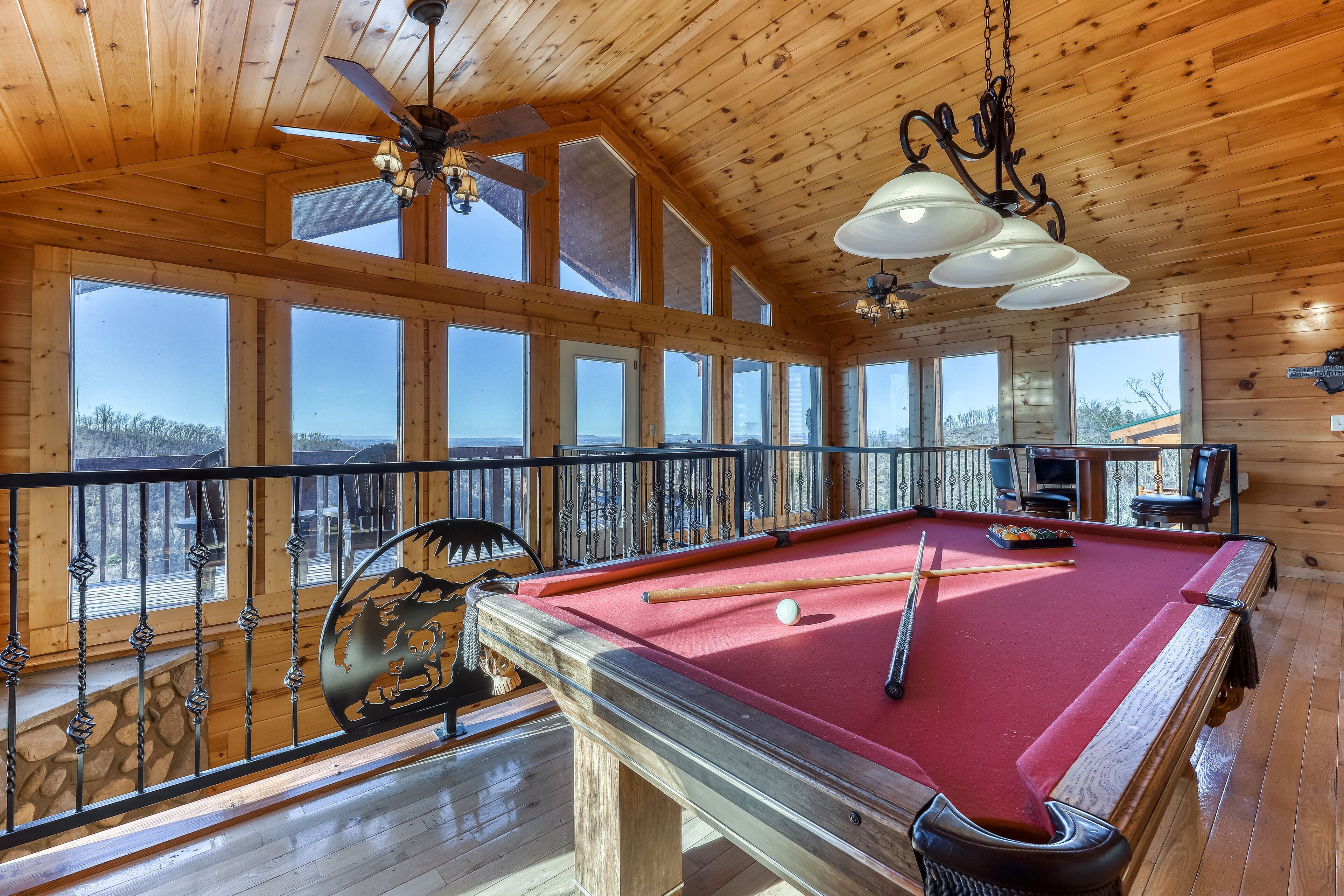 Lovely cabin with hot tub, theater, game room, community pool, & mountain views