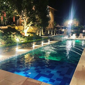 Outdoor pool, open 9:00 AM to 8:00 PM, pool umbrellas