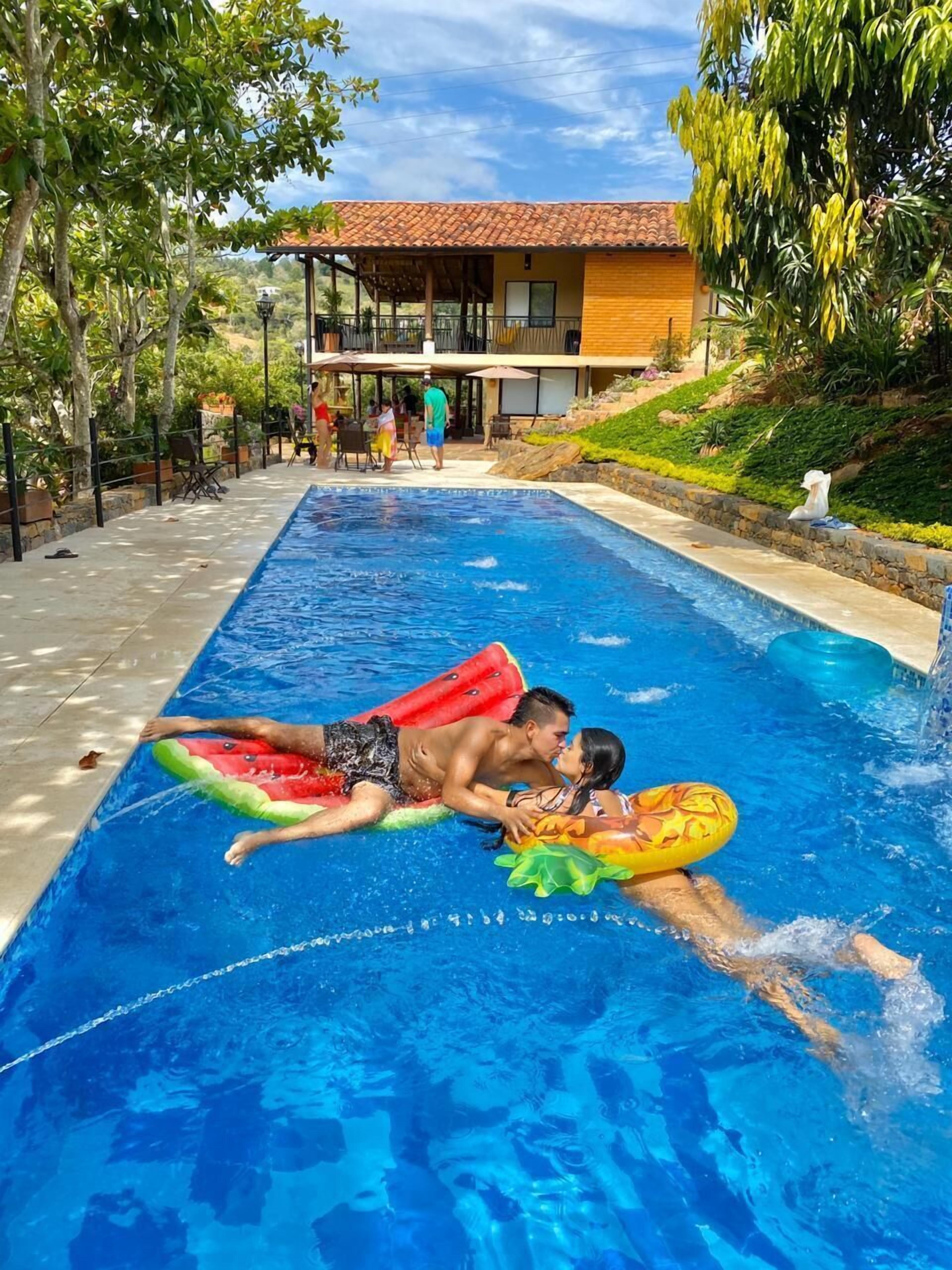 Outdoor pool, open 9:00 AM to 8:00 PM, pool umbrellas