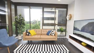 City Apartment | Living area | 55-inch flat-screen TV with digital channels, LCD TV