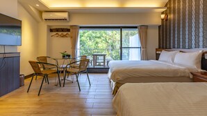 A hotel room with two beds, a dining area with chairs, a small table, and a large window with curtains. - Jimei Rustic Homestay (Ji'an)
