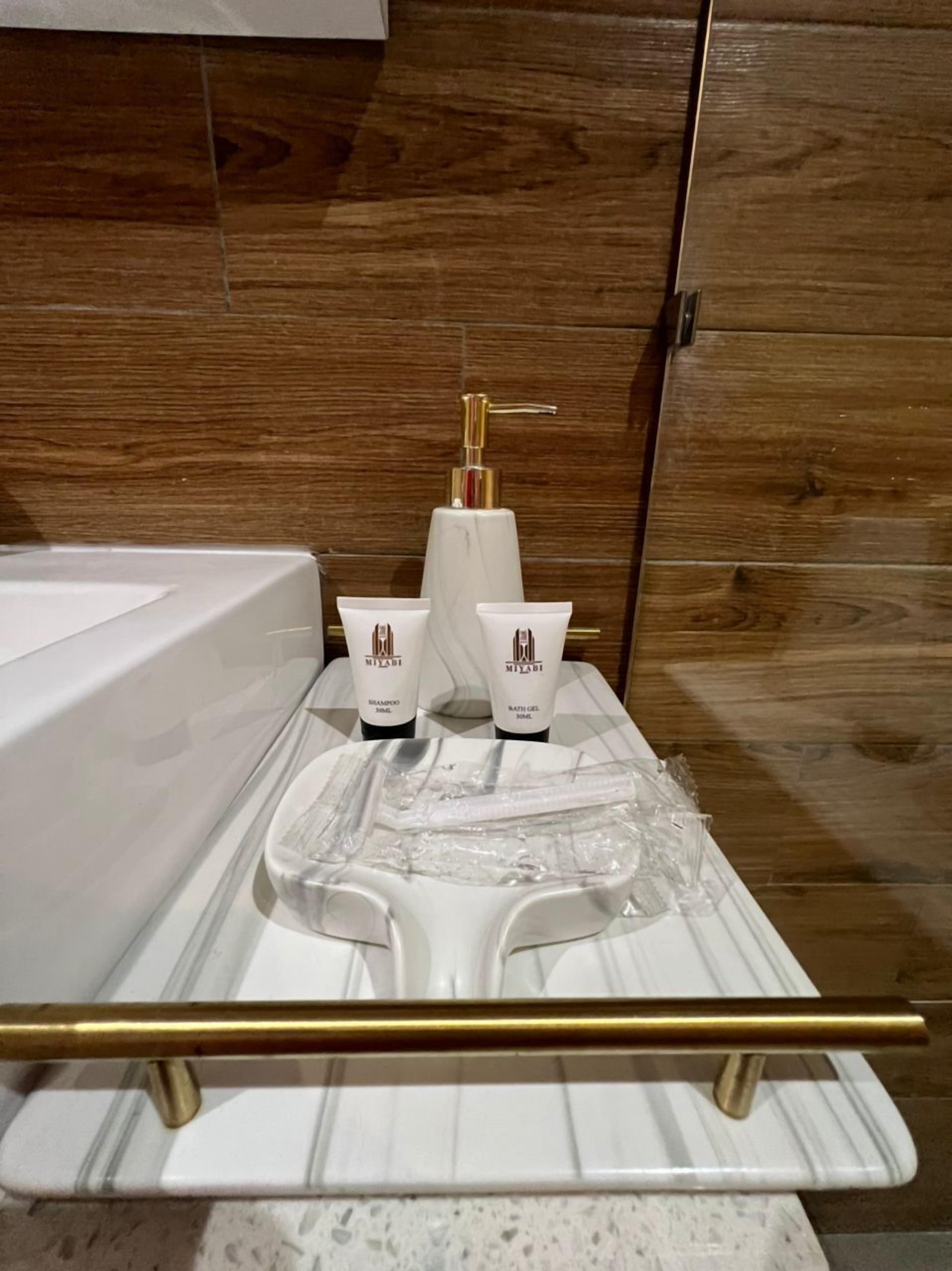 studio suite | bathroom | shower, hair dryer, towels, soap