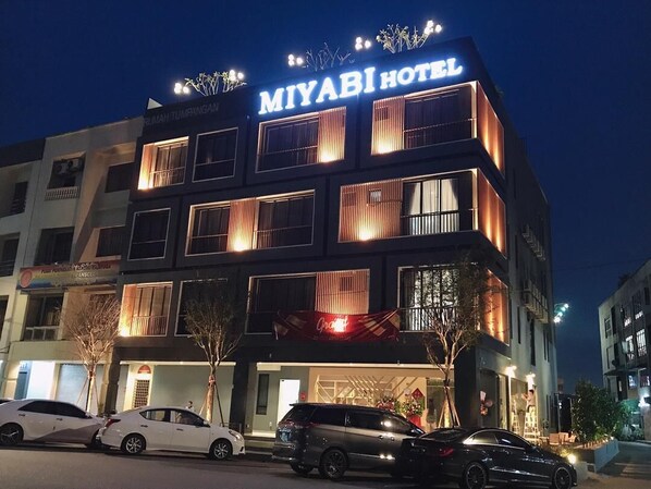 A hotel with a prominent sign reading "MIYABI HOTEL" and a visible entrance. - Miyabi Hotel (Masai)
