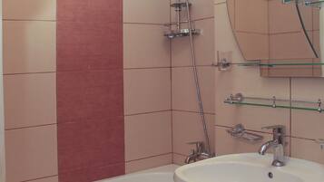 Bathtub, hair dryer, towels