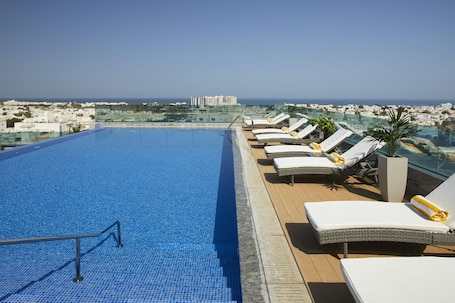 Outdoor pool, open 7:00 AM to 8:00 PM, pool umbrellas, sun loungers