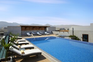 Outdoor pool, open 7:00 AM to 8:00 PM, pool umbrellas, sun loungers