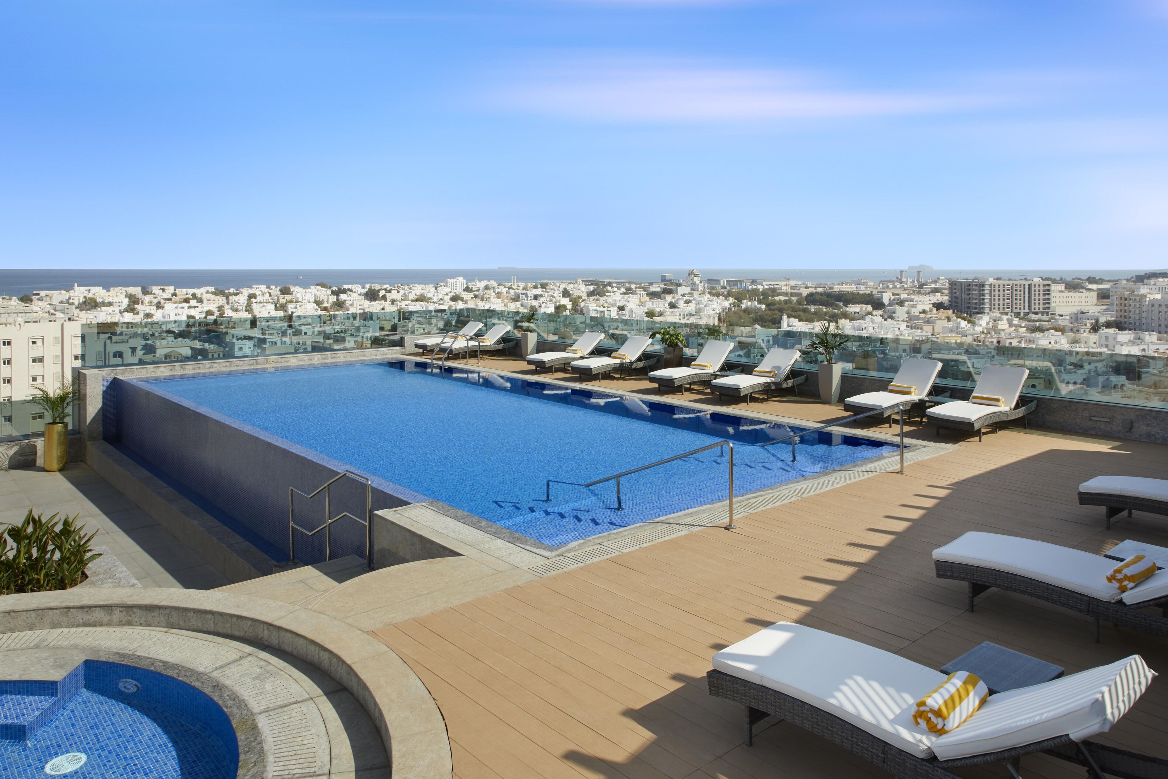 outdoor pool, open 7:00 am to 8:00 pm, pool umbrellas, pool loungers