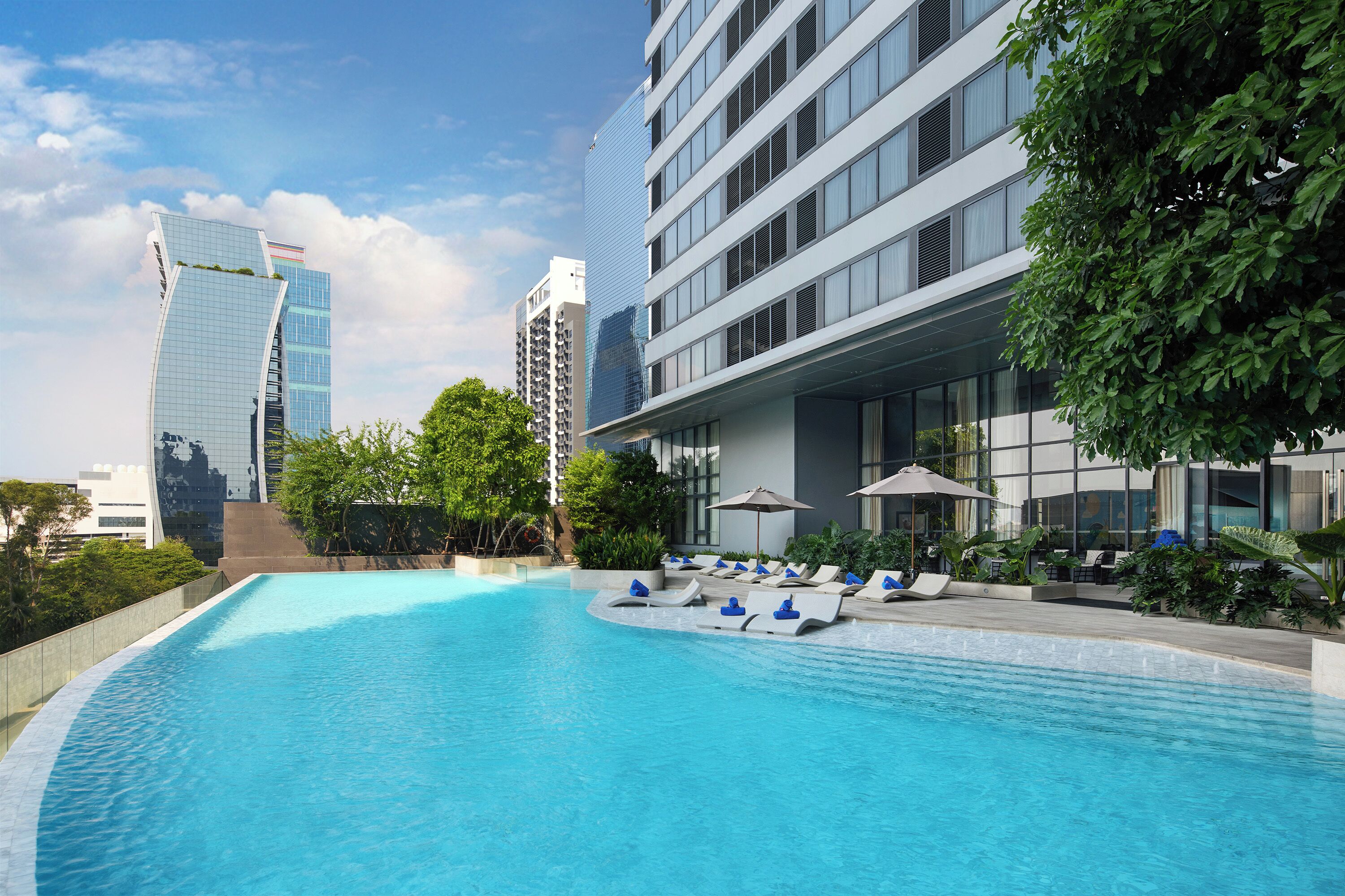 Outdoor pool, open 6:00 AM to 10:00 PM, sun loungers