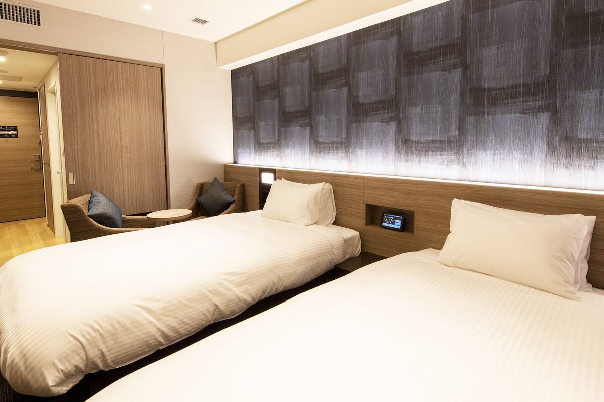 twin room | in-room safe, desk, blackout curtains, iron/ironing board