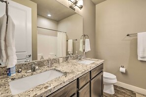 A bathroom with two sinks, a toilet, and a large mirror. - Family Home w/ Deck, 3 Mi to Downtown Flagstaff! (Flagstaff)