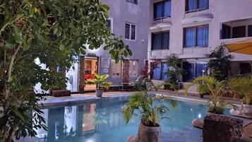 Outdoor pool, pool umbrellas, sun loungers