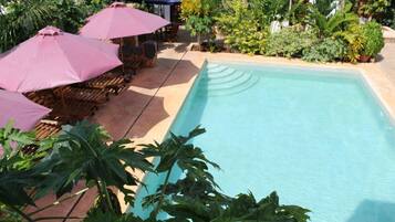 Outdoor pool, pool umbrellas, sun loungers