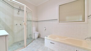 Bathtub, eco-friendly toiletries, hair dryer, soap