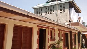 A building with a sign reading "ADONAI GUEST HOUSE". - Adonai Guest House (Mtwapa)