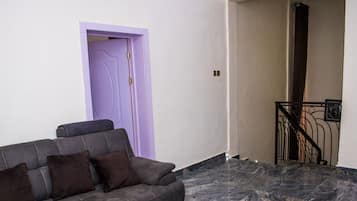 Luxury Apartment | Living room | 32-inch flat-screen TV with satellite channels, TV