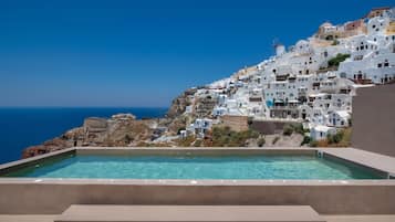 Seasonal outdoor pool, pool umbrellas, pool loungers