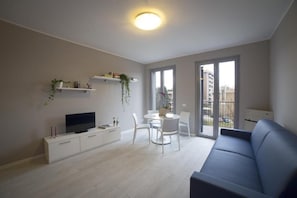 Basic Apartment, 2 Bedrooms (Trilocale Basic) | Living area | 32-inch LCD TV with digital channels, TV, heated floors - Aurum ApartHotels Pianell (Milan)