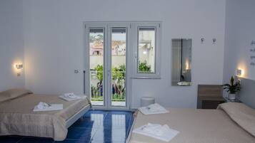 Quadruple Room, Balcony (Grotta dell'isola) | Premium bedding, down comforters, individually decorated, desk