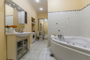 Apartment, 1 Bedroom | Bathroom | Bathtub, hair dryer, towels, toilet paper - Lovely Bright Apartment V. Vasilkivska (Kyiv)