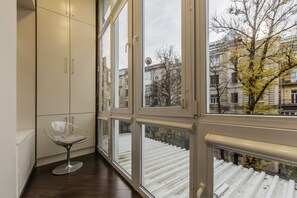 A corner room with a clear view of a staircase and buildings outside. - Gorgeous Cozy Apartment at Horodetskogo (Kyiv)