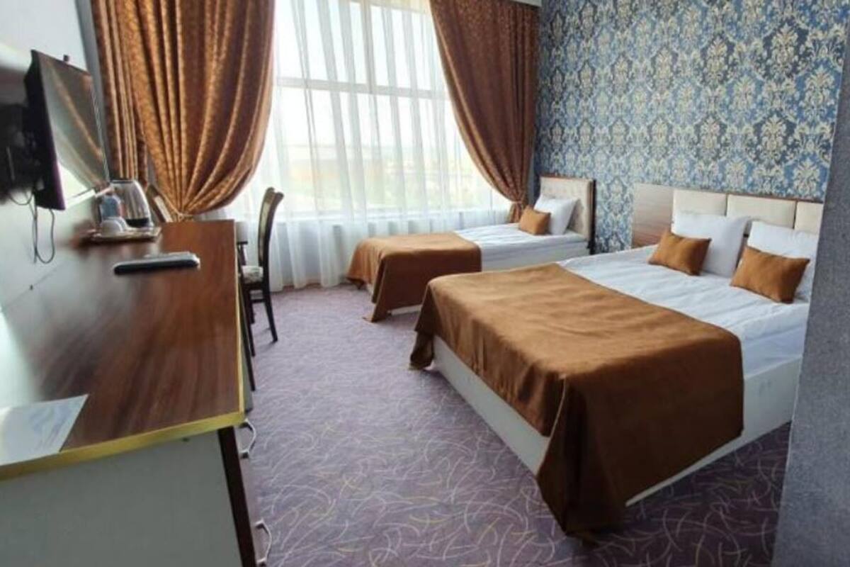 Kamar Triple Ekonomi, Beberapa Tempat Tidur, pemandangan laut | Kedap suara dan Wi-Fi gratis