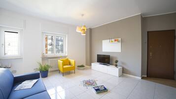 Apartment, 2 Bedrooms | Living room | Flat-screen TV