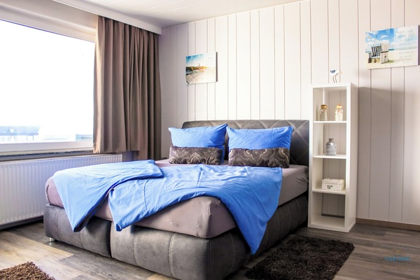 Cuxland-Fewo-Service - Haus Atlantic  - Wohnung 607 A  - Wohn - Schlafzimmer